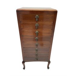 Early 20th century mahogany music cabinet fitted with eight fall front drawers with art deco design handles, on cabriole supports 