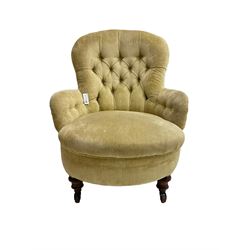 19th century armchair, upholstered in button pale yellow fabric with sprung seat, raised on turned feet with brass and ceramic castors