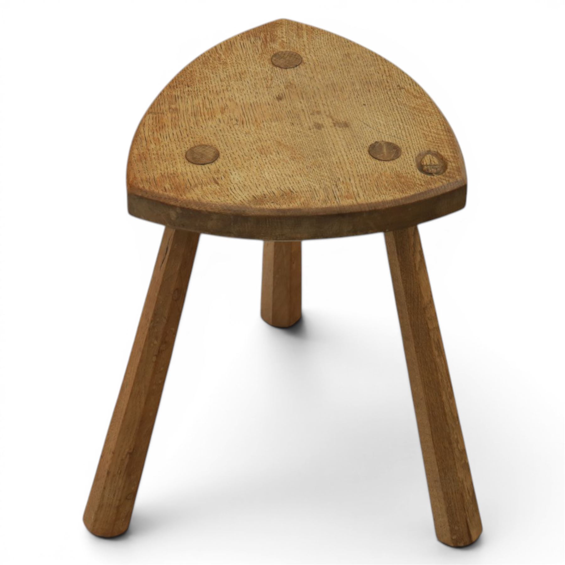 Acornman - oak milking stool, with signature acorn carving by the workshop of Alan Grainger of Brandsby