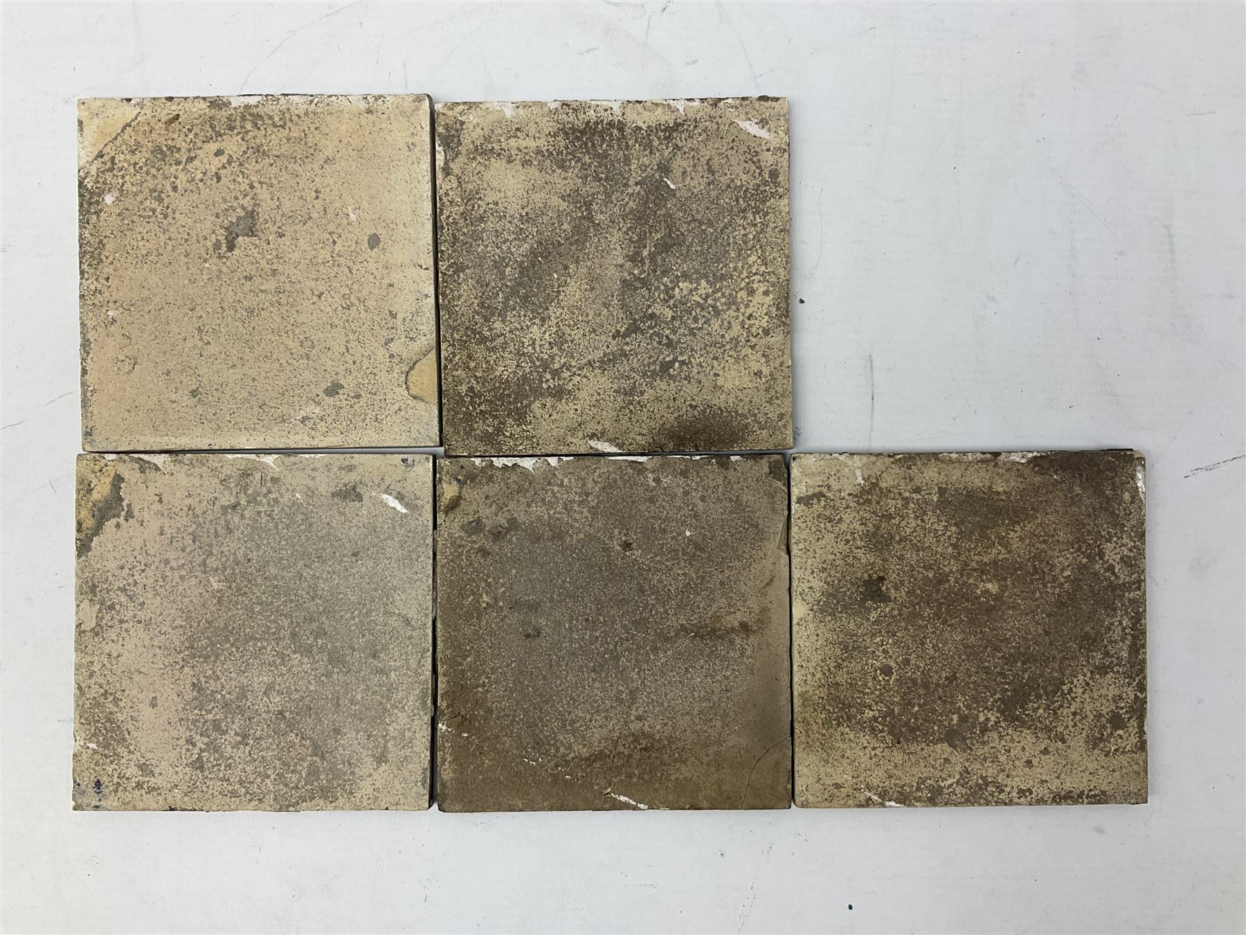 Five 19th century blue and white Delft tiles, each decorated with a central circular panel, containing buildings, boat, and swan, and a Victorian lustre mug decorated with polychrome flowers, tiles H13cm W13cm. 