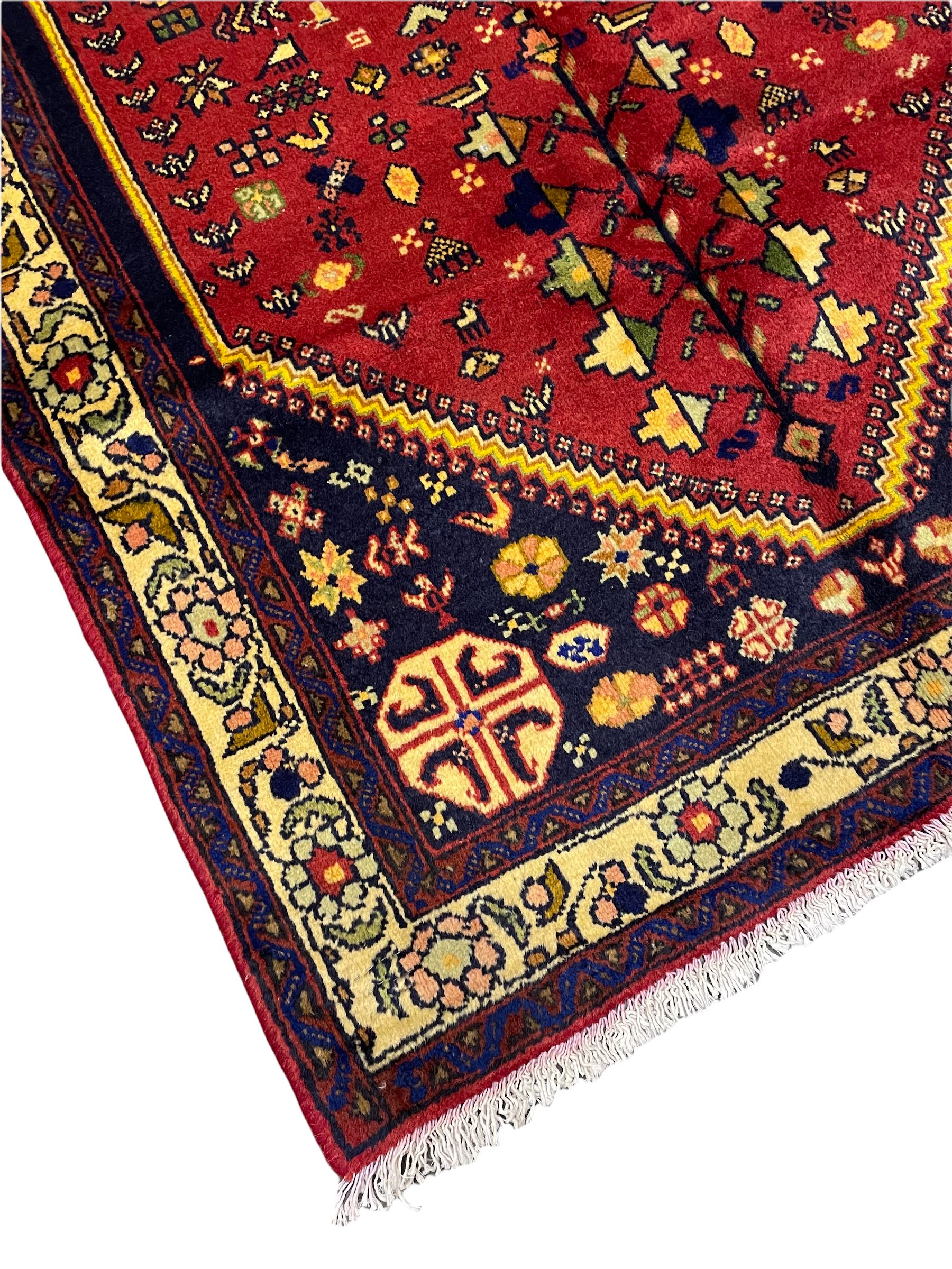 Small Persian Abadeh rug, blue ground with red lozenge field decorated with small bird and plant motifs, triple band border with floral design