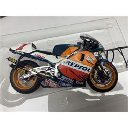 Three Ixo Models 1:12 scale die-cast models of motorcycles - BRB007 Honda NSR500 Michael Doohan 1998; BRB001 Honda RC211V Valentino Rossi 2003; and Yamaha YZR-M1 Colin Edwards MotoGP Phillip Island 2007; all boxed (3)