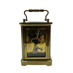 French-19th century timepiece carriage clock in brass corniche case with a cylinder platform escapement. With key. 