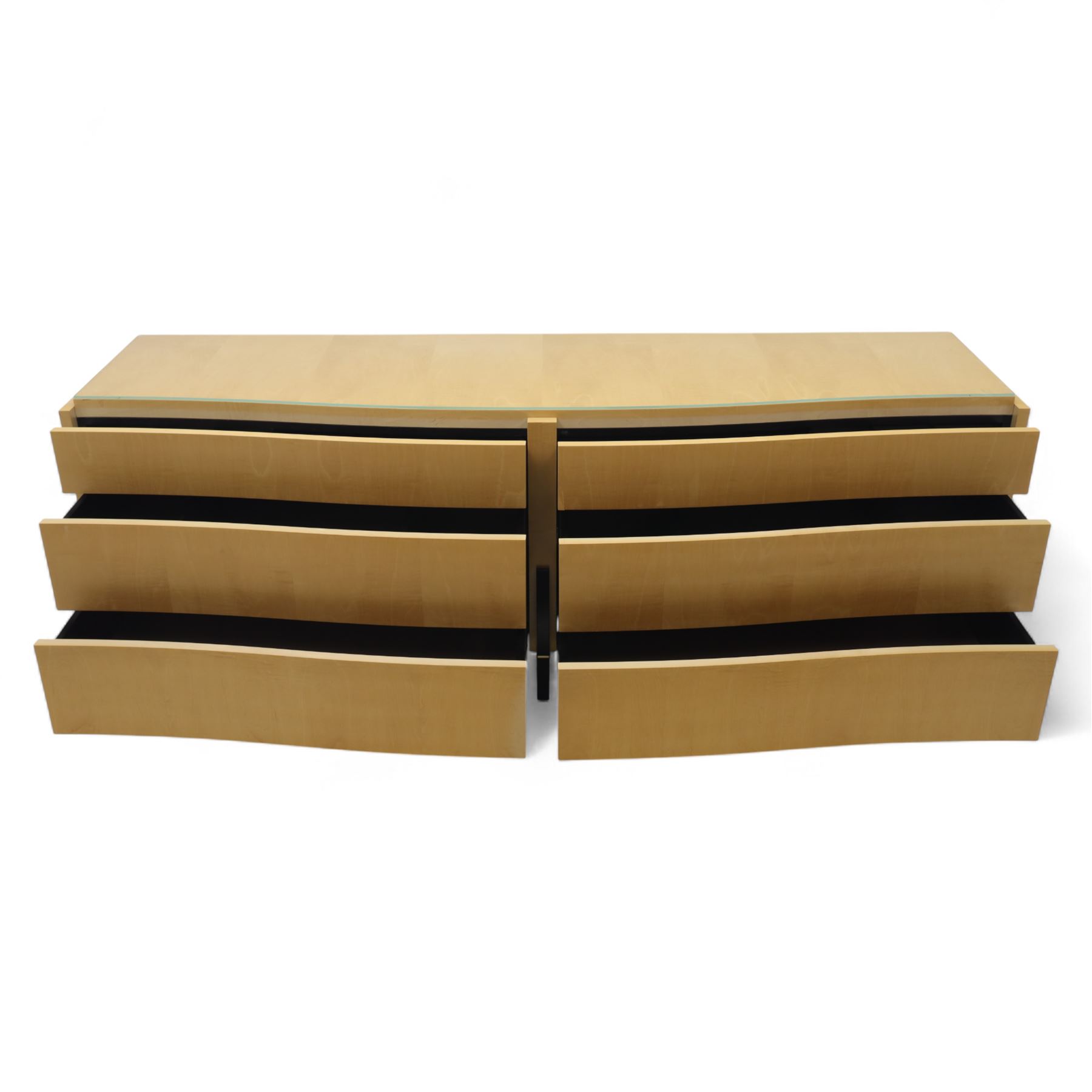 Contemporary maple veneered sideboard, serpentine glass top over six graduating Blum soft-close drawers, raised on curved black and gilt accented supports