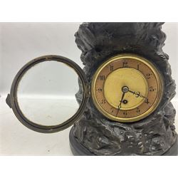 Early 20th century spelter effect figure of a sailor standing in the bow of a boat scanning the horizon, on a simulated rock base with a plaque entitled 'Rescue', base fitted with a timepiece clock movement and two-part dial, with pierced hands, gilt dial centre and ivorene chapter ring written in Arabic numerals, German HAC spring driven going barrel movement wound from the front; with pendulum H65.5cm
