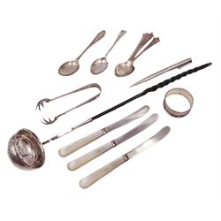 Group of silver, comprising toddy ladle, inset with Spanish coin and with baleen twist handle, three mother of pearl handled butter knives, a Yard-O-Led pencil and a collection of flatware, including pair of sugar tong with claw bowls