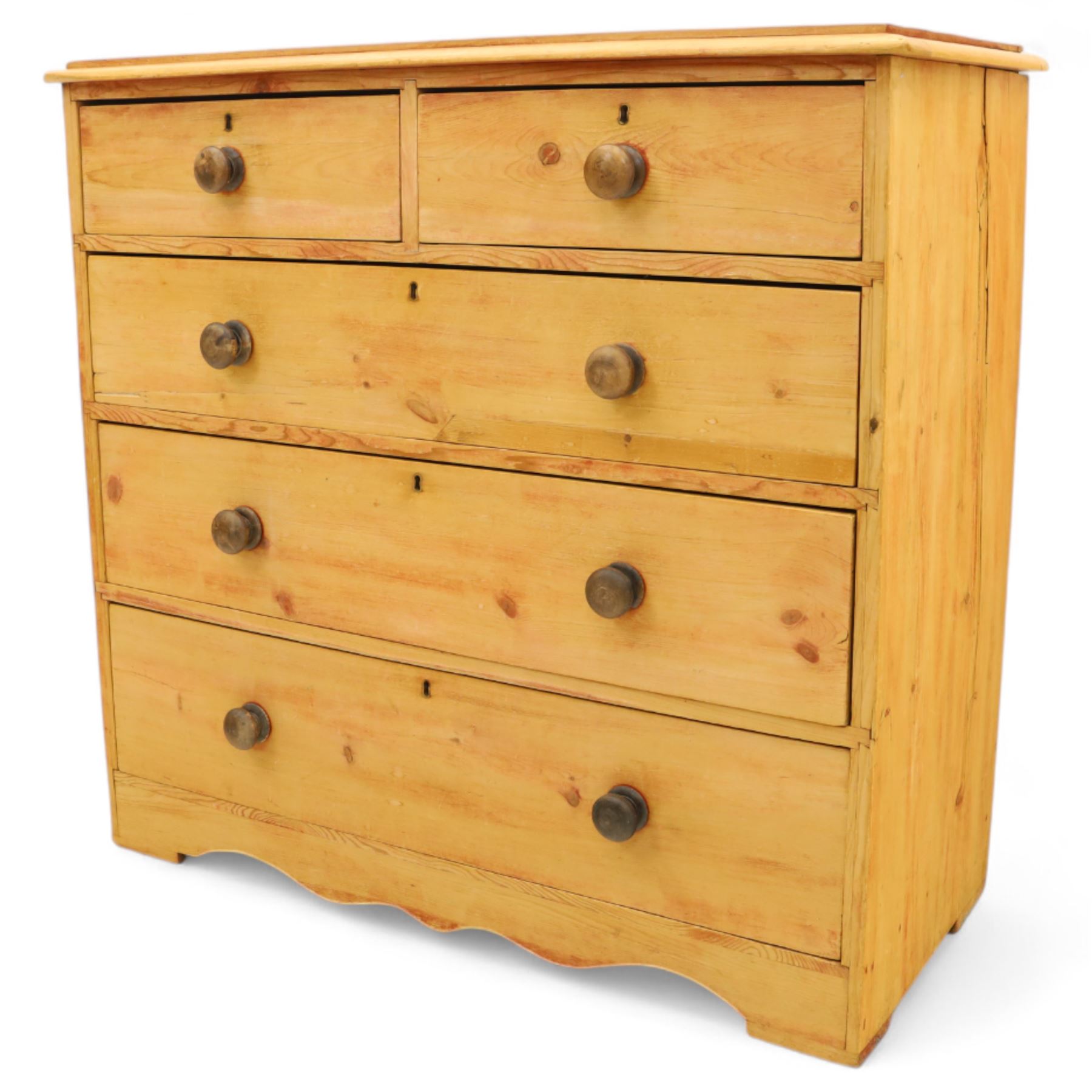 Victorian stripped pine chest, fitted with two short and three long drawers, turned wooden handles, shaped lower apron on bracket feet