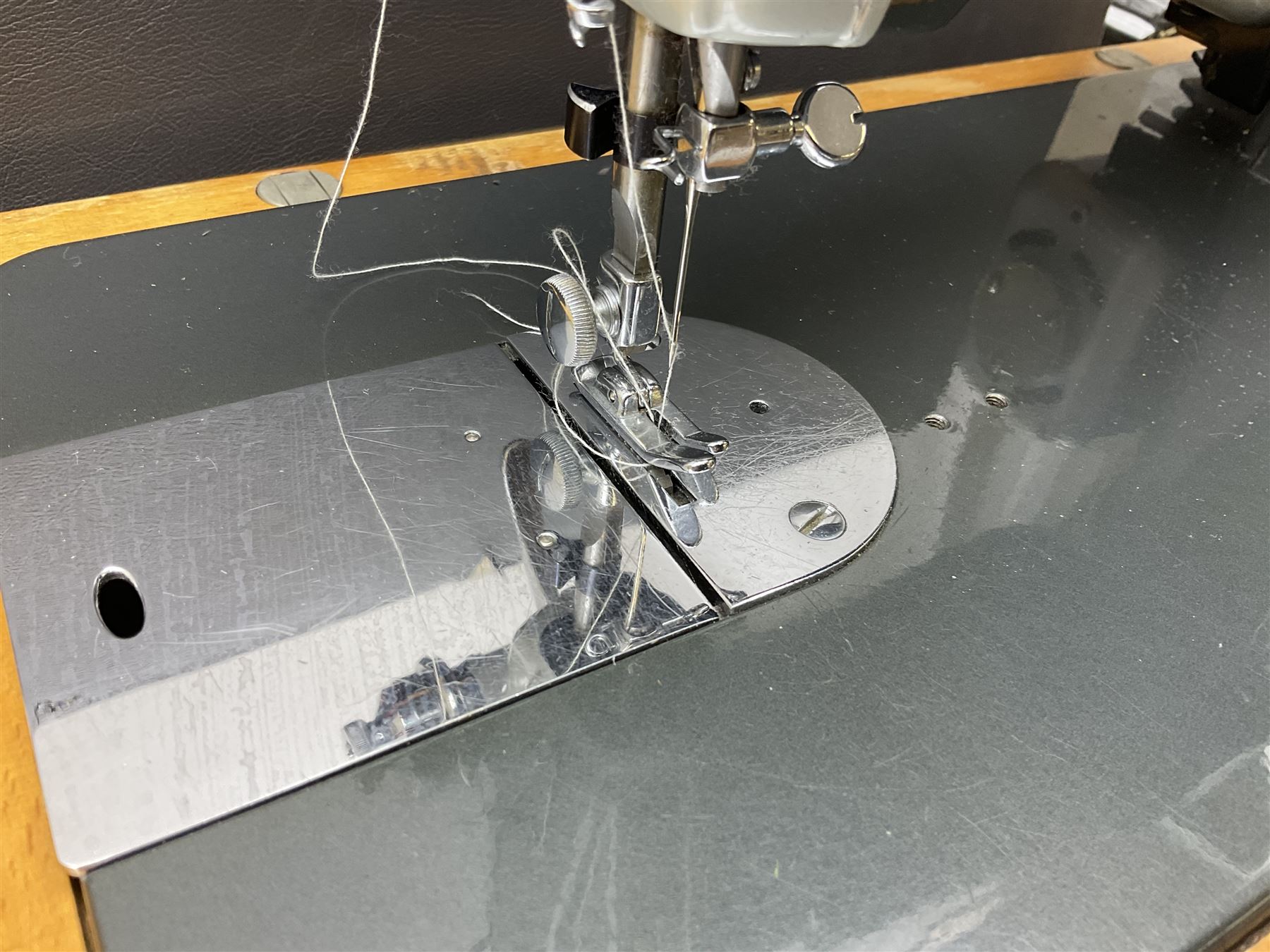 Vintage Brother electric sewing machine in case together with a Frister and Rossmann model 45 sewing machine in case