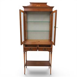Sheraton design yew wood cabinet on stand, fitted with two glazed doors and two drawers, with lower shelf, illuminated interior