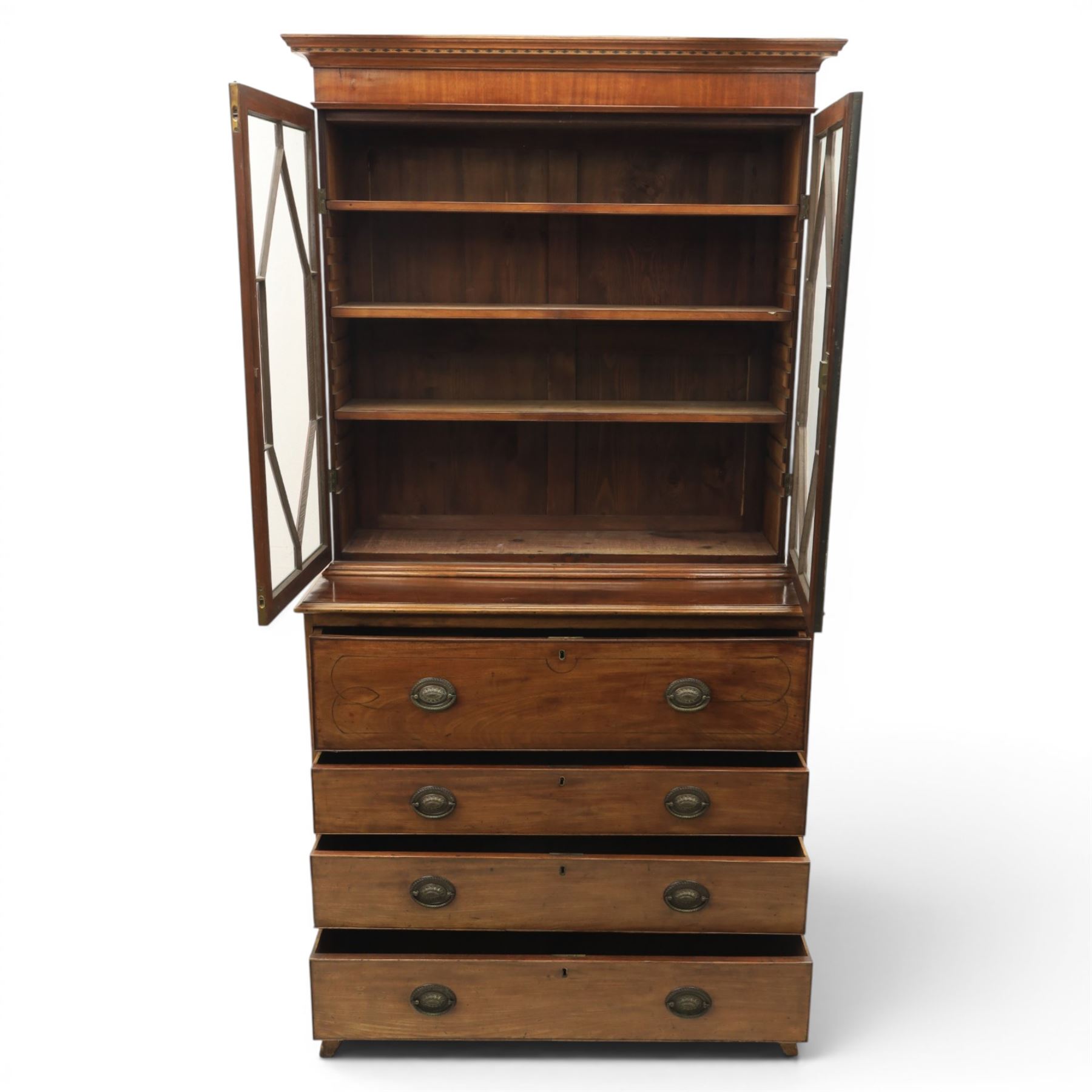 George III mahogany secretaire bookcase, the upper section with projecting cornice above astragal glazed doors, with three adjustable shelves, the lower section with secretaire drawer, fitted and with tooled leather writing surface, inlaid drawer fronts with brass handles, three graduating drawers below, raised on bracket feet