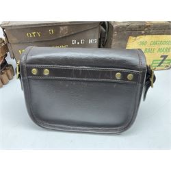 Miscellaneous shooting accessories - W.J. Bowman & Sons clay pigeon launcher; two leather cartridge belts; three cartridge bags; two canvas/leather game bags; and two metal/wooden cartridge boxes