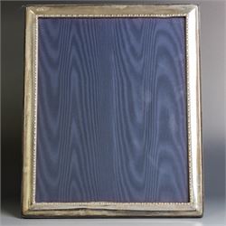 Late 20th century silver photograph frame, rectangular with beaded decoration to inner edg...