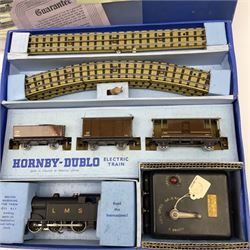 Hornby Dublo - three-rail EDG7 Tank Goods train set with LMS 0-6-2 tank locomotive No.6917, two wagons, guards van, quantity of straight and curved track and controller with tested ticket, boxed with instructions, guarantee, oil and spanner.