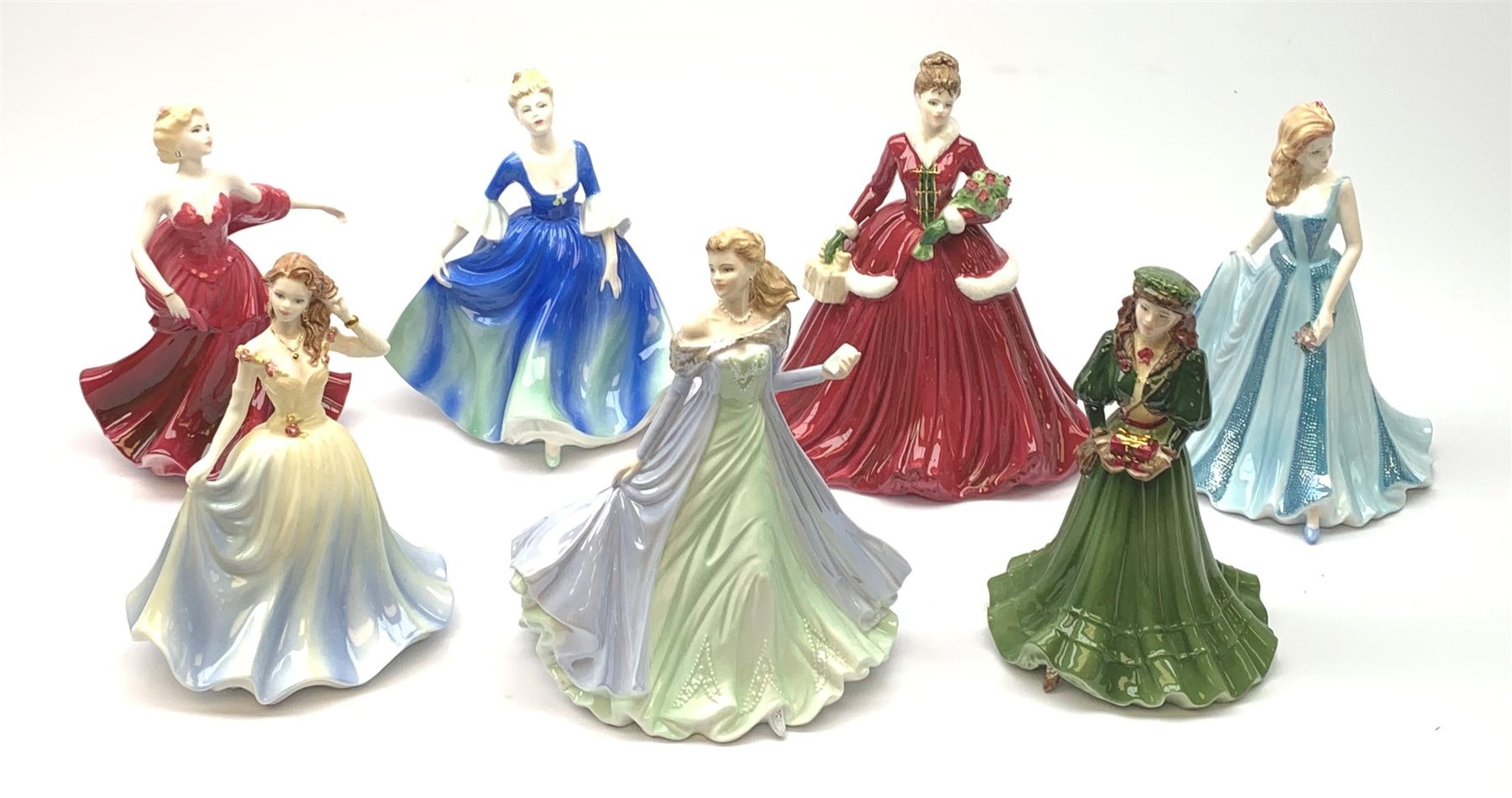 A group of seven Coalport Ladies of Fashion figurines, comprising Grace, Marion, Jean, Natalie, The Birthday Girl, A Gift at Christmas, and Merry Christmas 2005, three with boxes. (7). 