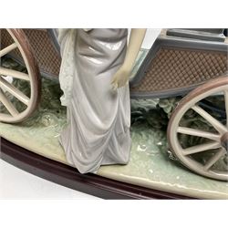 Large Lladro figure, The Landau Carriage, modelled as a horse drawn open top carriage, on a mahogany base, no 1521, sculpted by Juan Huerta, year issued 1987, year retired 1998, H30cm 