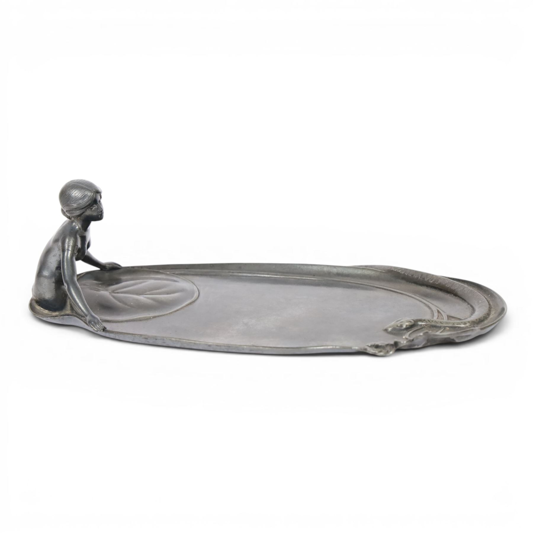 WMF Art Nouveau pewter tray, of oval from, with a female figure covered with a lily pad at one end, and snake with flowers and whiplash stems at other, signed and impressed marks beneath, H8cm, L25cm 