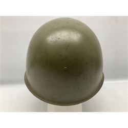 Two 1960s East Block Soviet style helmets - Czechoslovakian and Russian; both with liners (2)