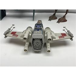 Star Wars - four space/land vehicles comprising Millenium Falcon with hinged top and figures; TIE Fighter; X-Wing Fighter with pilot; and AT-ST 'Chicken Walker' transporter; all unboxed (4)