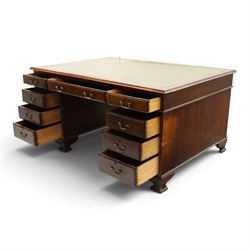 D Matthews & Son Office Furnishers (Liverpool) - Edwardian mahogany twin pedestal partners desk, rectangular top with inset green leather writing surface, fitted with an assortment of twelve drawers with brass swan neck handles, the pedestals with cupboards fitted to the opposing side, raised on ogee bracket feet