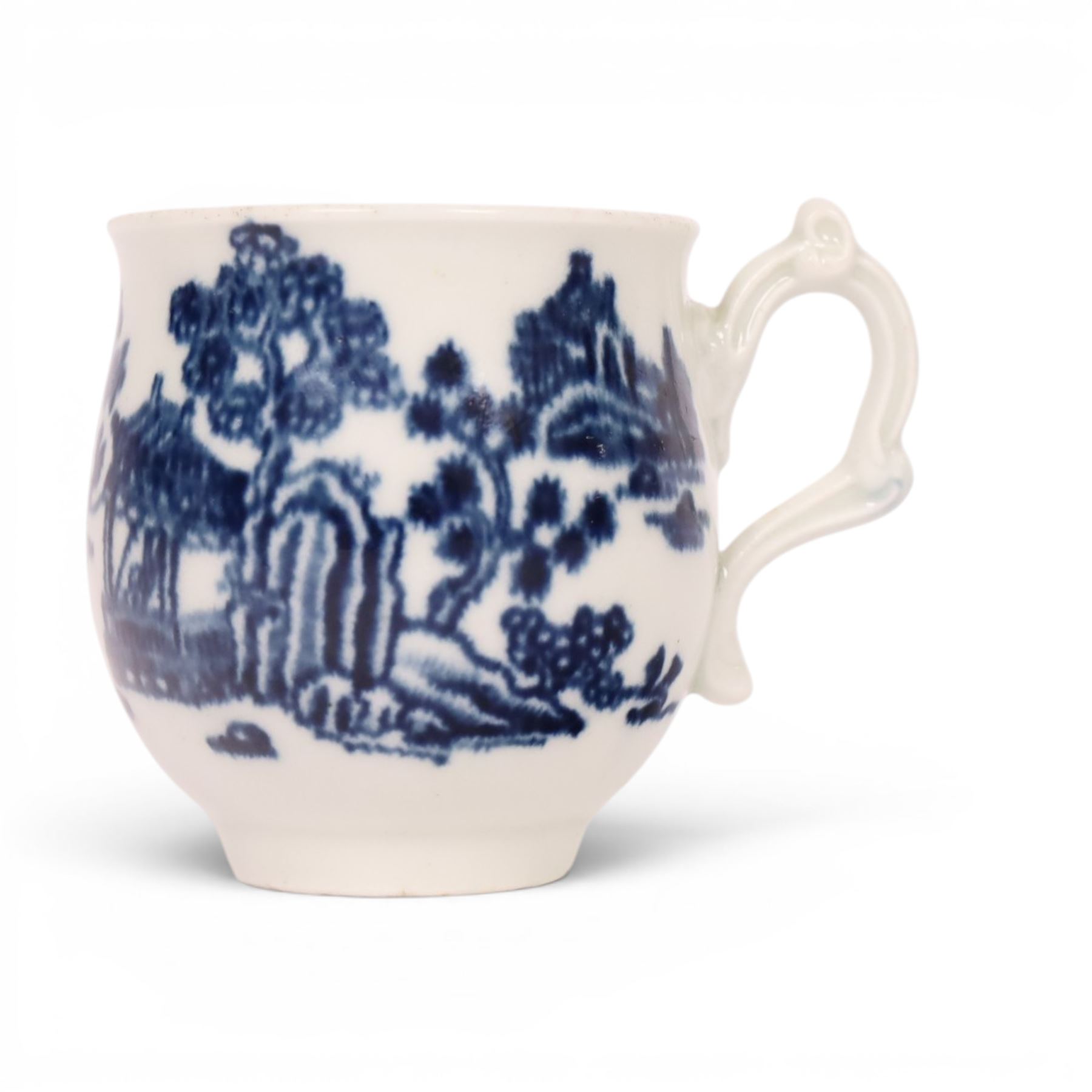 Worcester blue and white spoon tray, decorated in the Argument pattern, circa 1780-1785, L16cm, together with a Worcester blue and white bell shaped coffee cup with moulded scroll handle, decorated in the Man in the Pavilion pattern, circa 1760-1765, H6cm