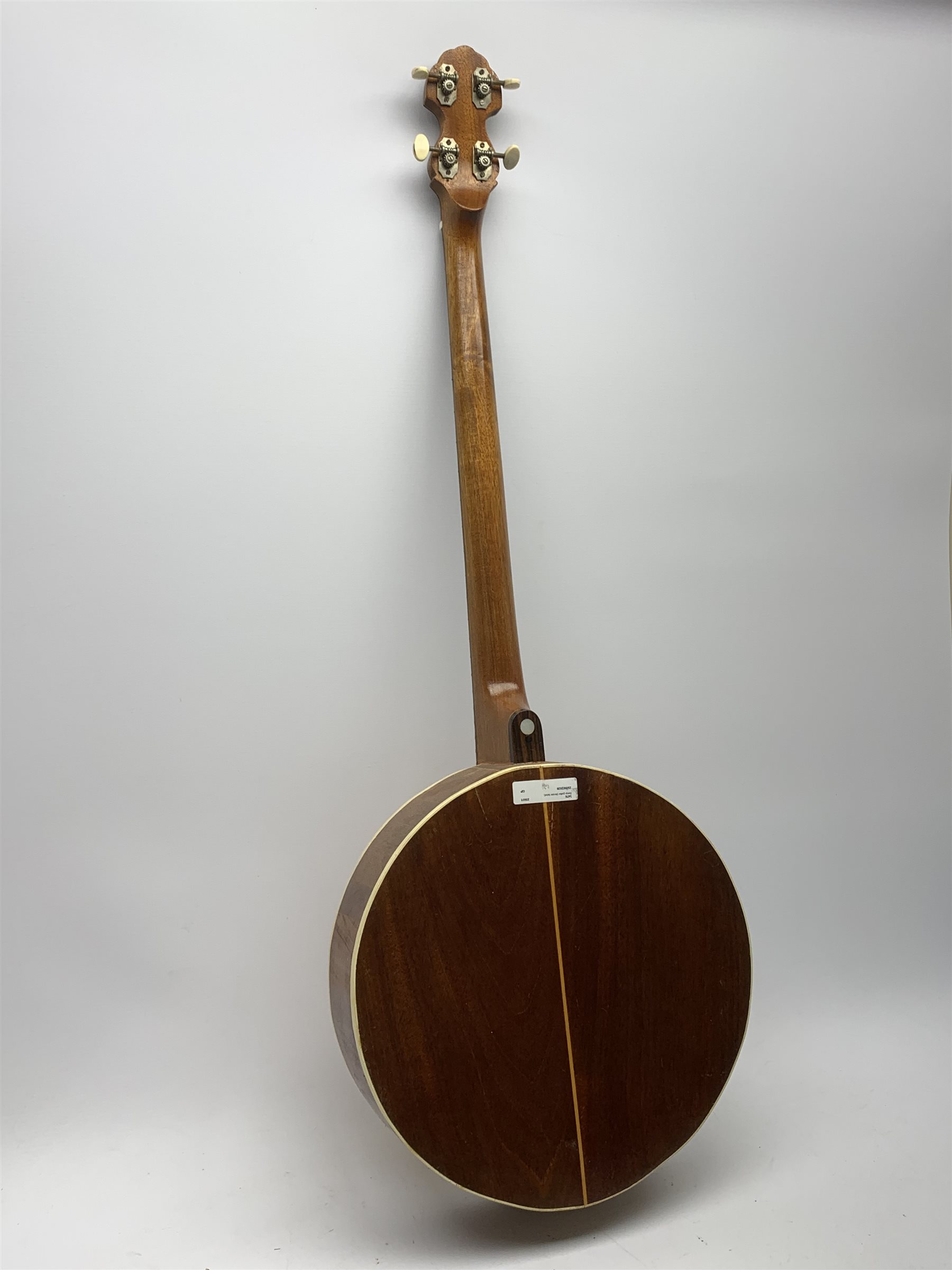 Four-string banjo guitar with mahogany circular back and sides and spruce top, mother-of-pearl inlaid fingerboard and headstock, bears humorous label 'Fender Bedpanjo', L95cm