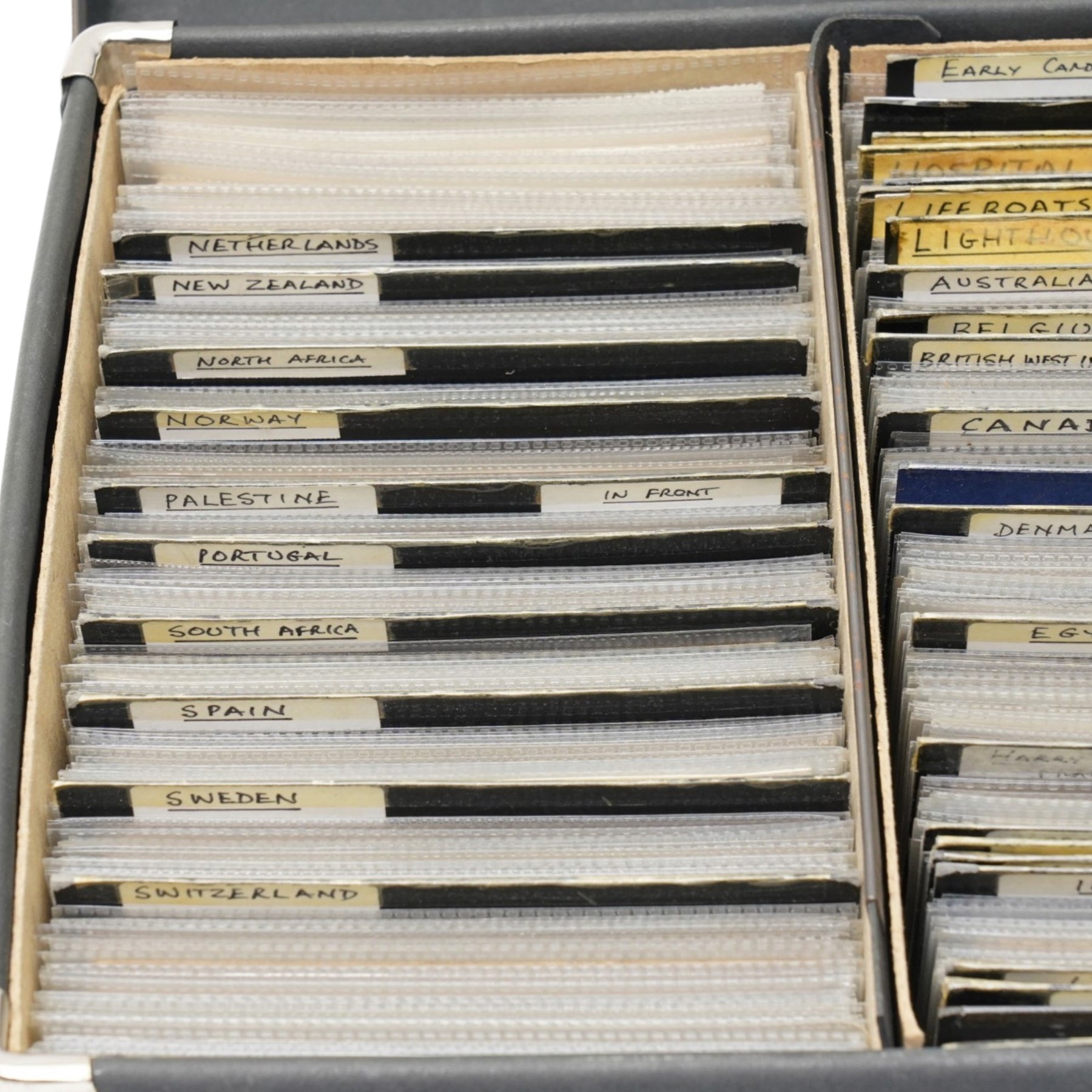 Case containing a large quantity of postcards including foreign topographical sorted by country, art and artists, comic, industrial etc over 1000 cards