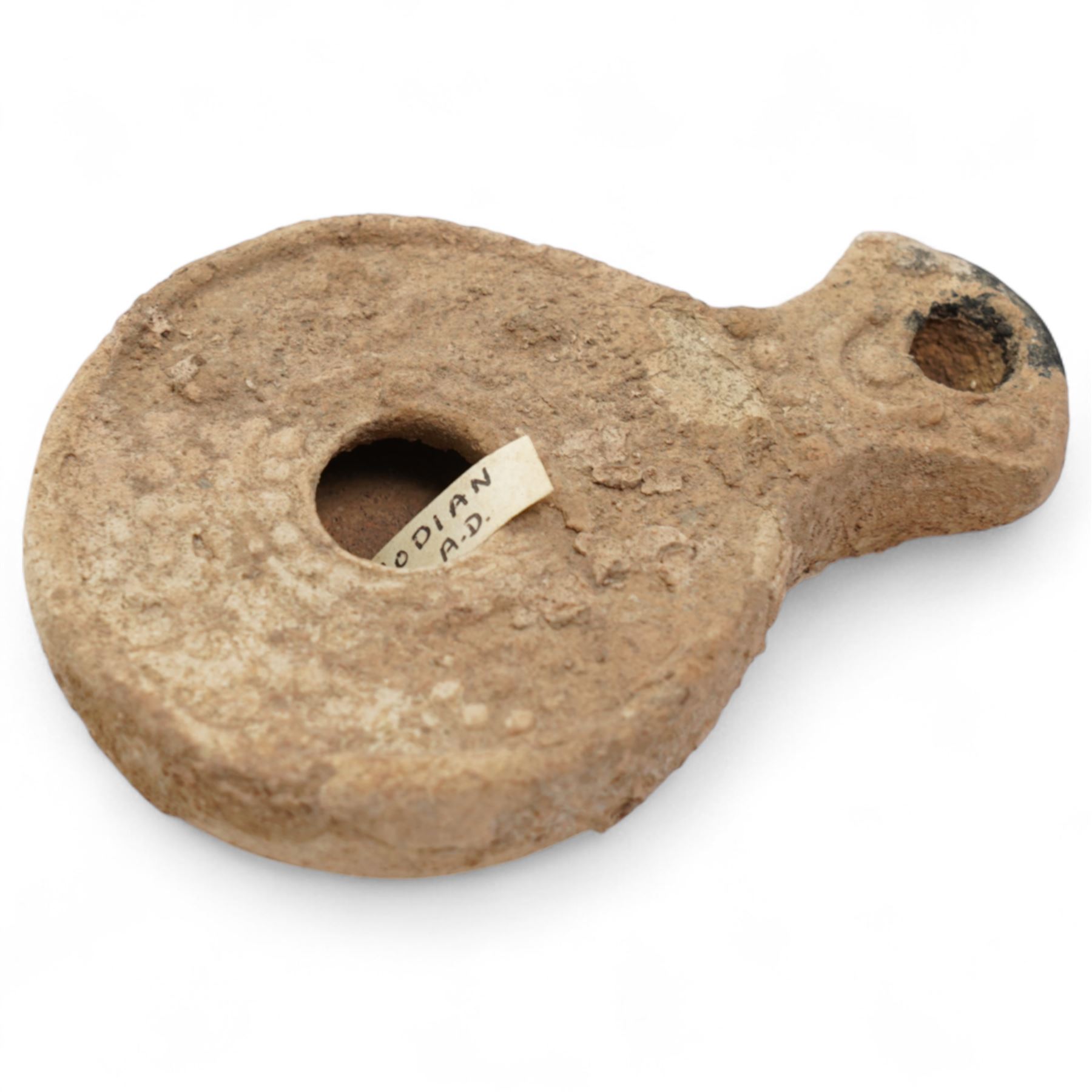 A group of five ancient terracotta oil lamps - Eastern Mediterranean (c.2nd century BC-1st century AD),
comprising a black-slipped Greek lamp (c.2nd-1st century BC) with a rounded body and narrow nozzle; a Herodian lamp (c.25 BC-75 AD) of compact form with central fill hole and pinched wick aperture; a Herodian lamp (c.1st century AD) with central raised disc and dotted ring motif; a Roman/Herodian hybrid lamp (c.50 BC-50 AD) with pronounced rounded shoulders and recessed top; and a further Roman/Herodian lamp (c.50 BC-50 AD) retaining an ancient carbonised wick fragment in the nozzle.
Provenance: By the vendor’s repute, acquired/collected in the Middle East (Dead Sea area/Syria) in the 1960s