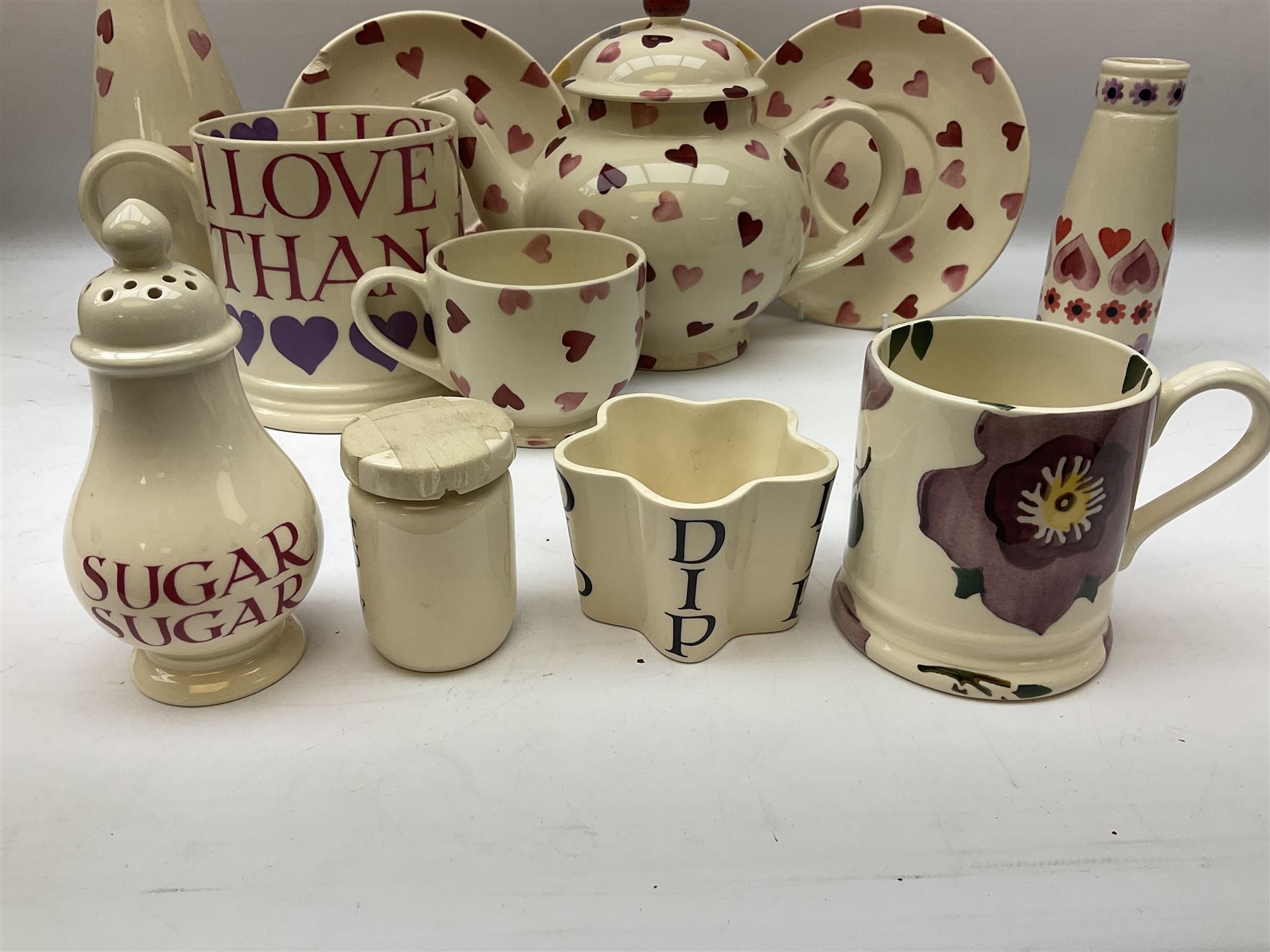 Collection of Emma Bridgewater spongeware ceramics, to include Pink Hearts pattern teapot, milk bottle vase, teacup and saucers, Love & Kisses sugar shaker and large 'I love you more than Marlon Brando' mug, British Birds and Black and White pattern mugs, etc, all with printed marks beneath, tallest H21.5cm