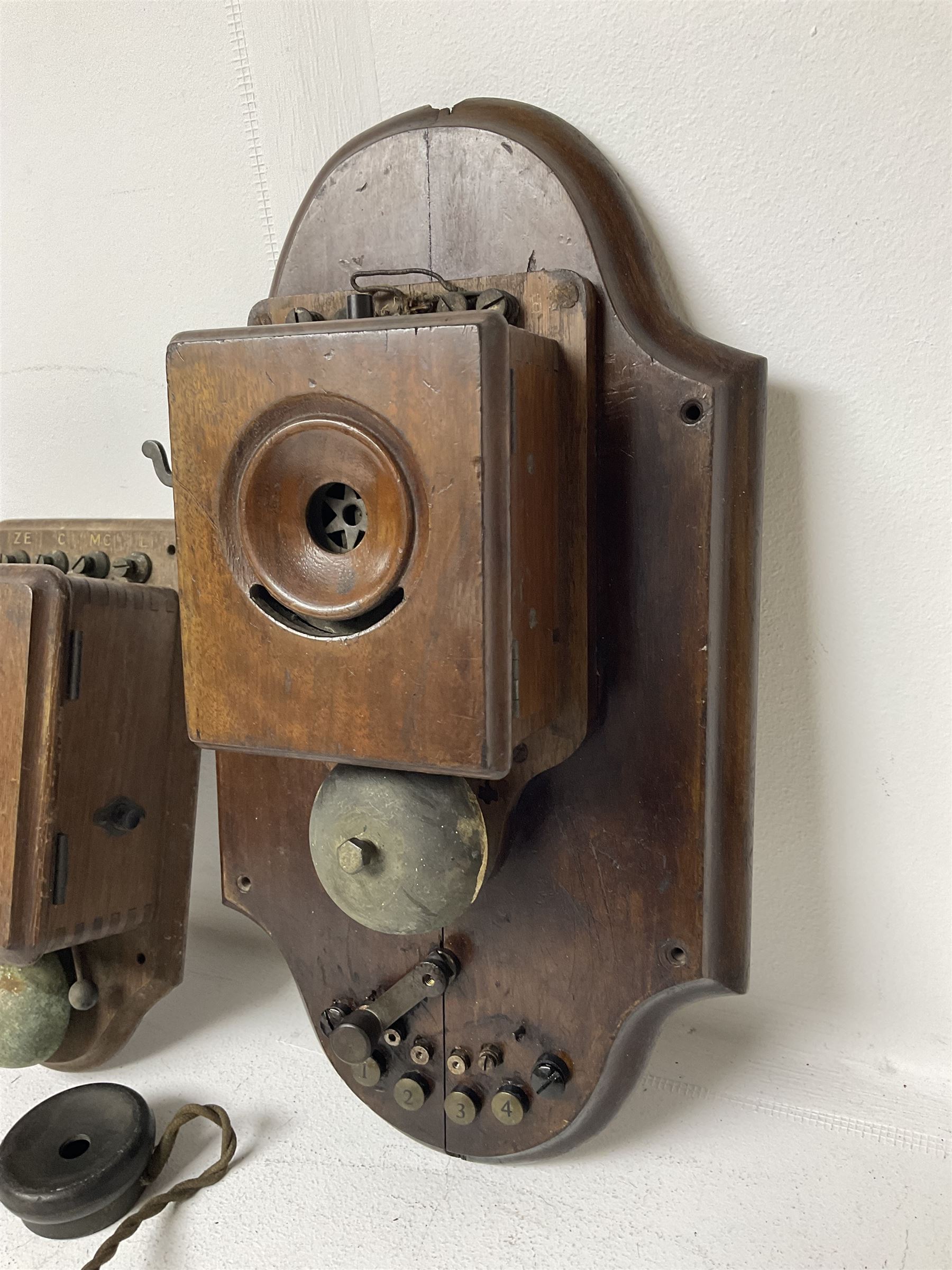 Two Hunningscone patent wall mounting telephones in walnut casing, together with Sterling Telephone & Electric Co. Ltd early wall-mounted telephone 'Primax' and one other 