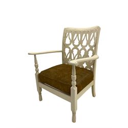 Early 20th century low painted open armchair, fretwork applied back, upholstered seat cushion, on turned supports
