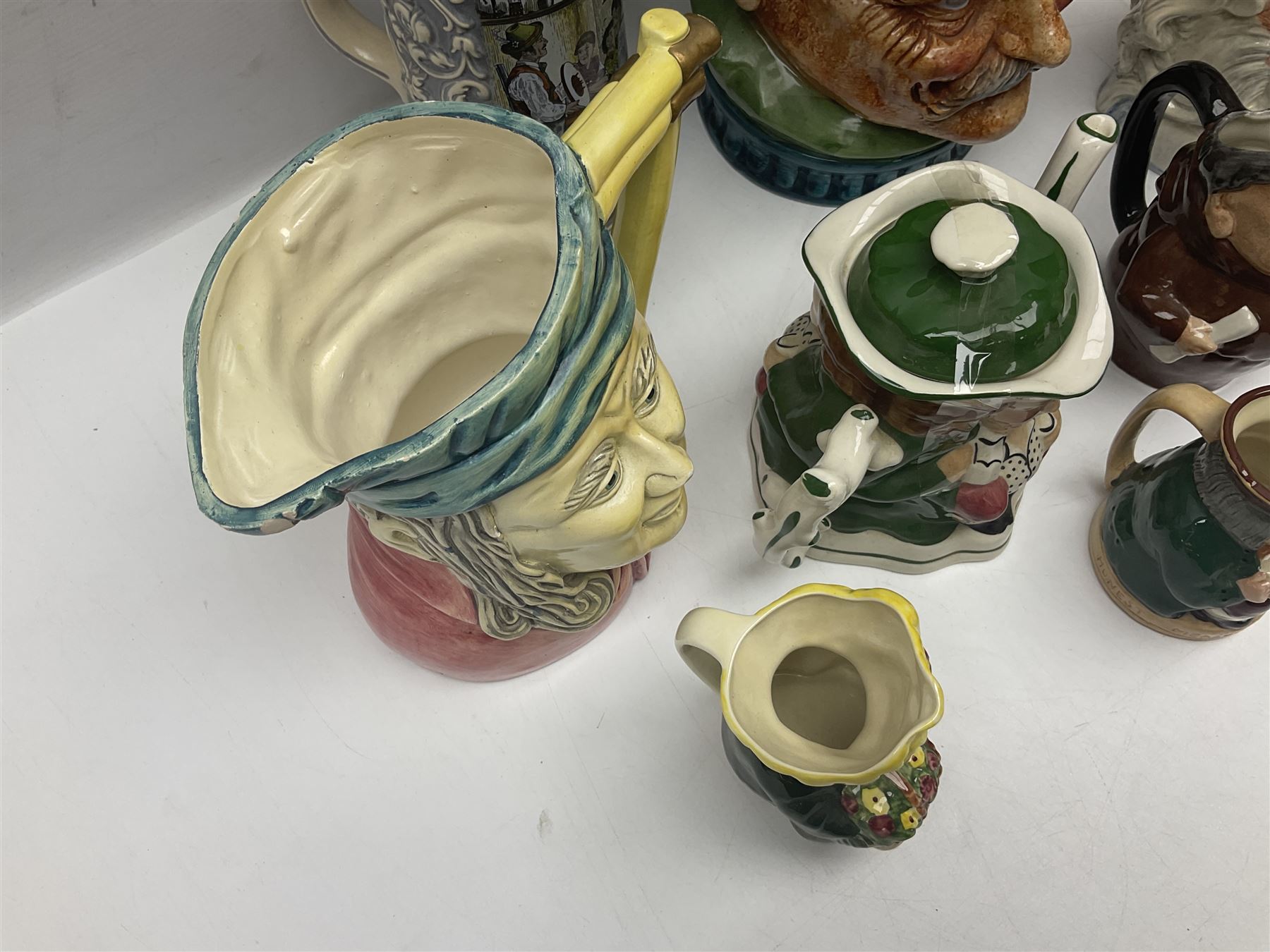 Collection of toby jugs and character jugs, to include Royal Doulton Winston Churchill and Neptune, together with Staffordshire Character Jugs examples  