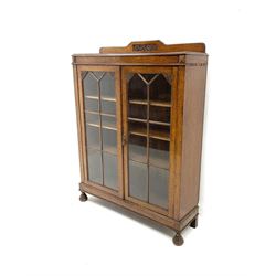 19th century oak display cabinet, two glazed doors enclosing three adjustable shelves, raised on turned on turned supports 