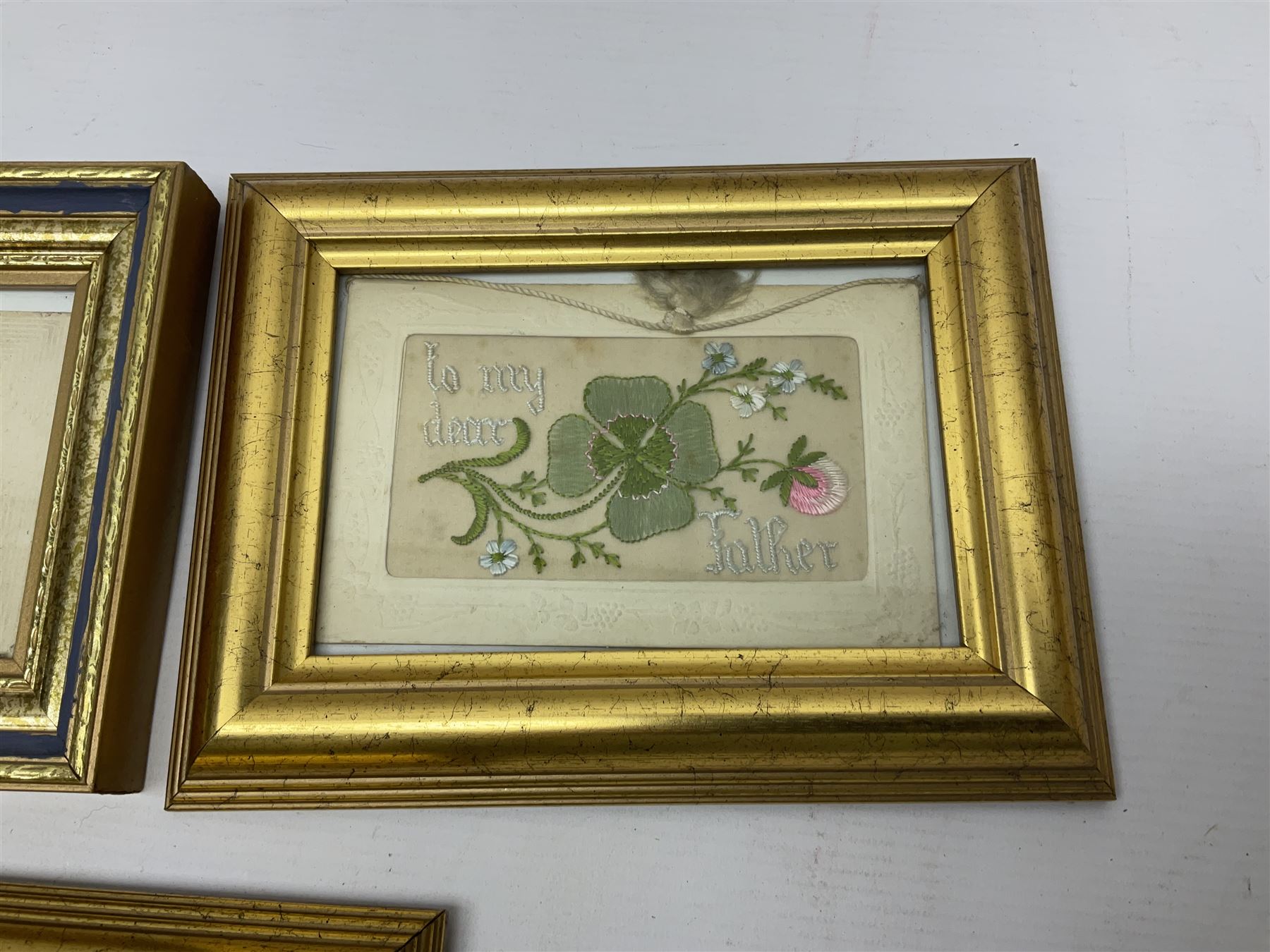 Collection of twenty eight, mostly WWI period embroidered silk greetings cards and postcards, including 'A kiss from France', good luck, sweetheart and Christmas examples, all within modern gilt frames