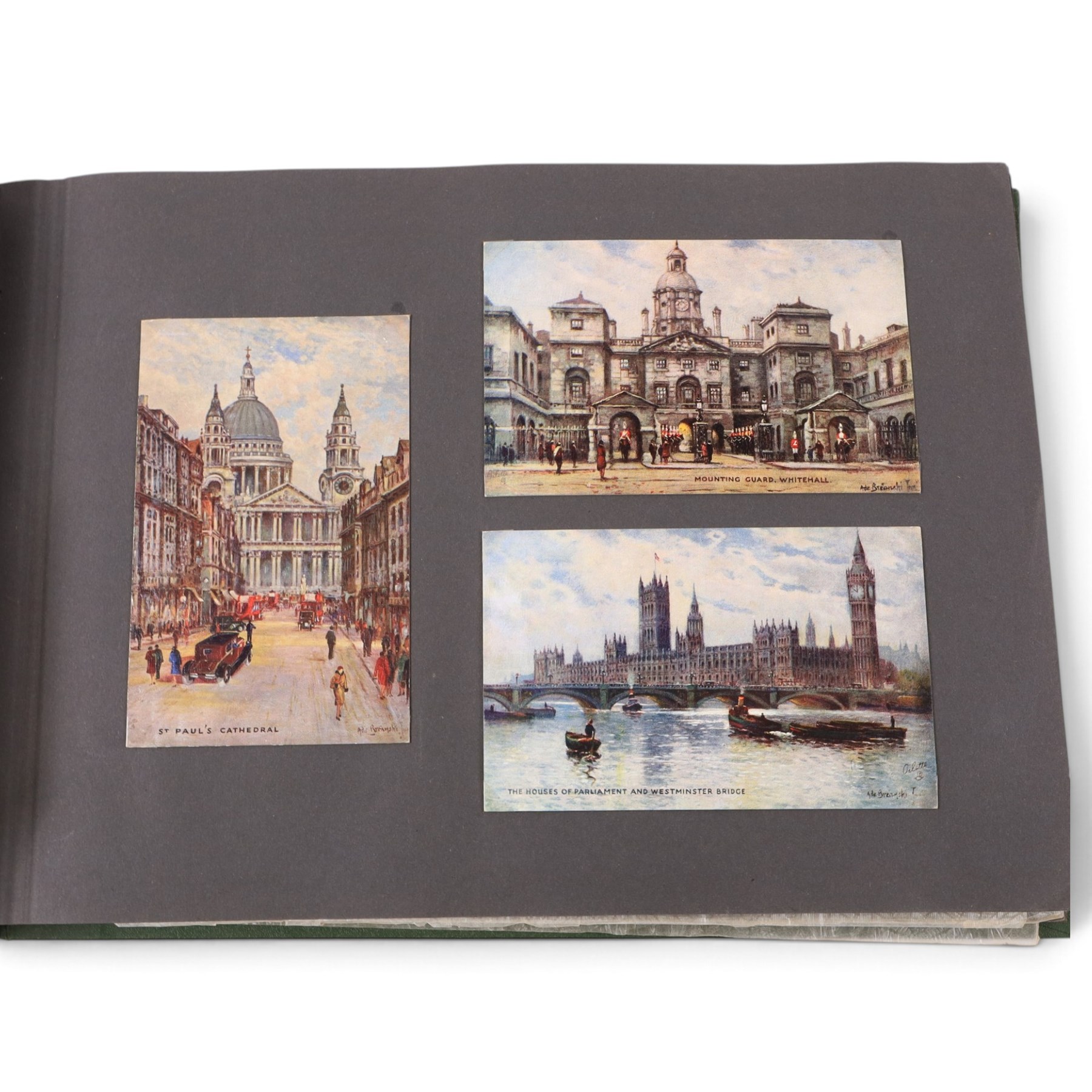 Two early to mid 20th century postcard albums, containing black and white and colour postcards, the first labelled Meine Reisen in Indien containing postcards of Arabia, India, Egypt, some personal photographs and newspaper clippings, of postcards, the second labelled Meine Reisen in England, containing mostly postcards of London, some greetings cards etc
