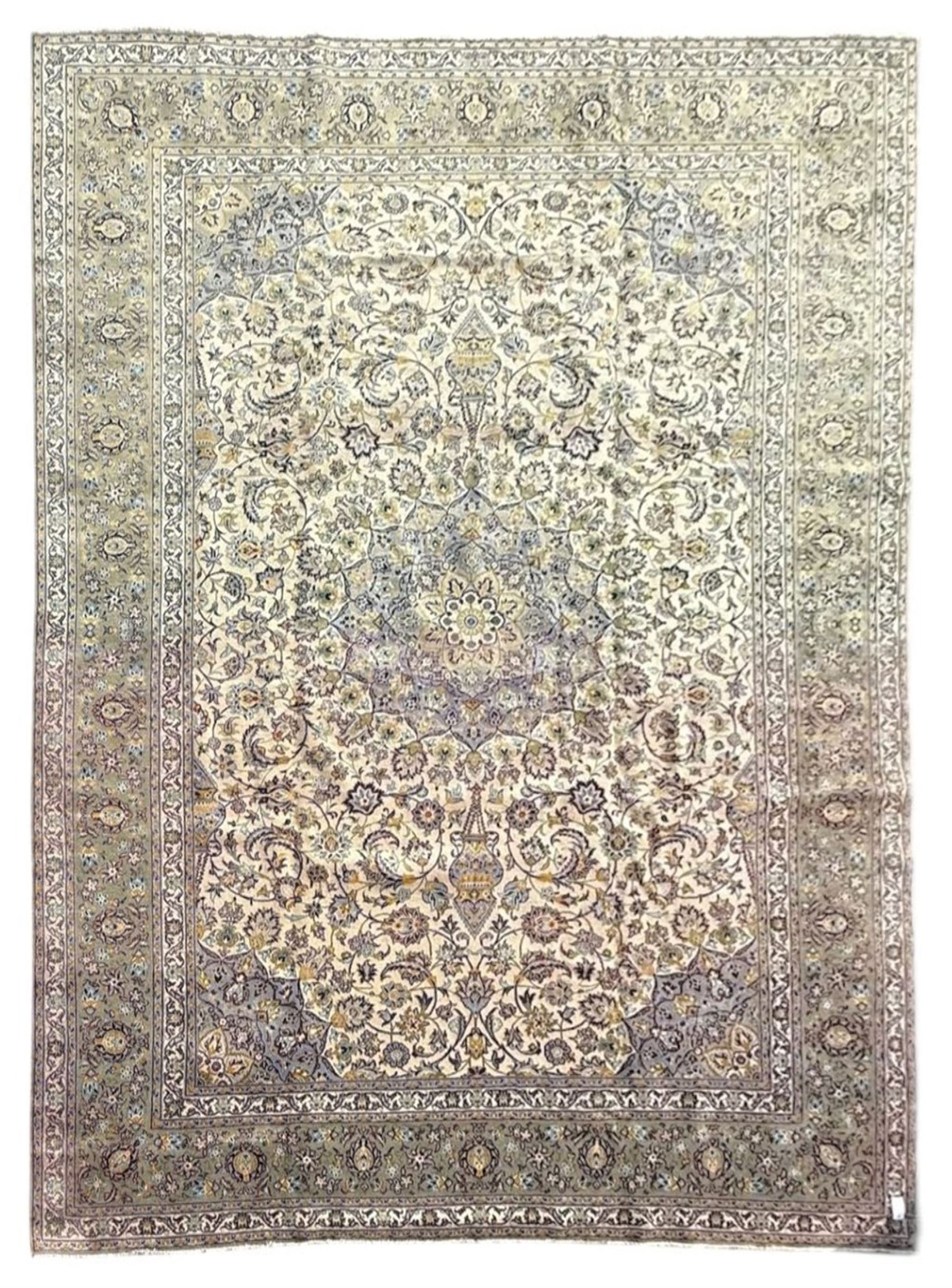 Kashan Persian rug, hand knotted, ivory ground rug, the rosette medallion decorated with projecting palmettes, on a field of swirling leafy branches and decorated with further palmettes, the scrolling border with repeating stylised plant motifs, within floral pattern guard stripes