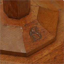 Squirrelman - oak standard lamp, the octagonal stepped base carved with the signature squirrel, the tapering octagonal column rising to a brass fitting, by Wilfrid Hutchinson, Husthwaite