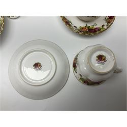 Royal Albert Country Roses pattern part tea and dinner service, to include teapot, four cups and saucers, four dessert plates, cake plate etc, (41)