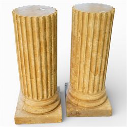 A pair of early 20th century Italian Neoclassical pedestal columns of simplified Doric typ...