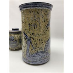 John Egerton (c1945-): studio pottery stoneware, comprising wine cooler decorated with herons on a mottled ground, covered storage jar with foliage decoration and a lamp base decorated with grape vines, wine cooler H23cm
