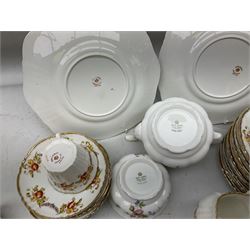 Quantity of Royal Albert tea wares to include 'Moss Rose' teapot, sucrier and saucers, together with teacups, saucers, side plates, jug etc decorated with orange, yellow and blue floral sprays with gilding upon plain ground, all stamped Royal Albert beneath