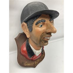 Composite figure of the head of a huntsman on a shield 'Caught by the Fox', D28cm