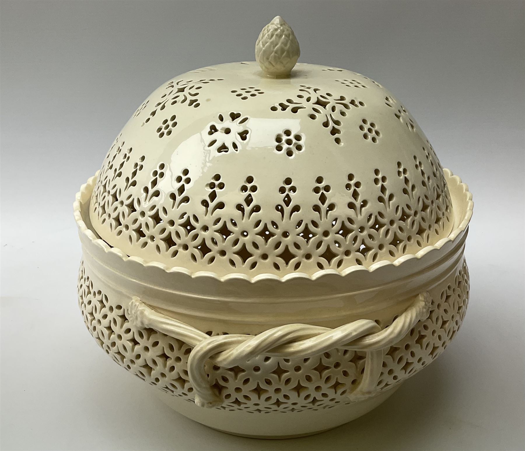 Large 20th century Leeds pottery basket and cover, of bulbous form with pierced detail and twin rope handle, with impressed mark beneath, H23cm D25cm