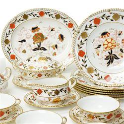 Royal Crown Derby Asian Rose pattern dinner service for twelve covers comprising  twelve dinner plates, twelve dessert plates, twelve two handled soup bowls and stands, pair of sauce boats and stands, pair of sauce tureens with covers and stands, pair of vegetable dishes and covers and two graduated meat plates, date code 1974