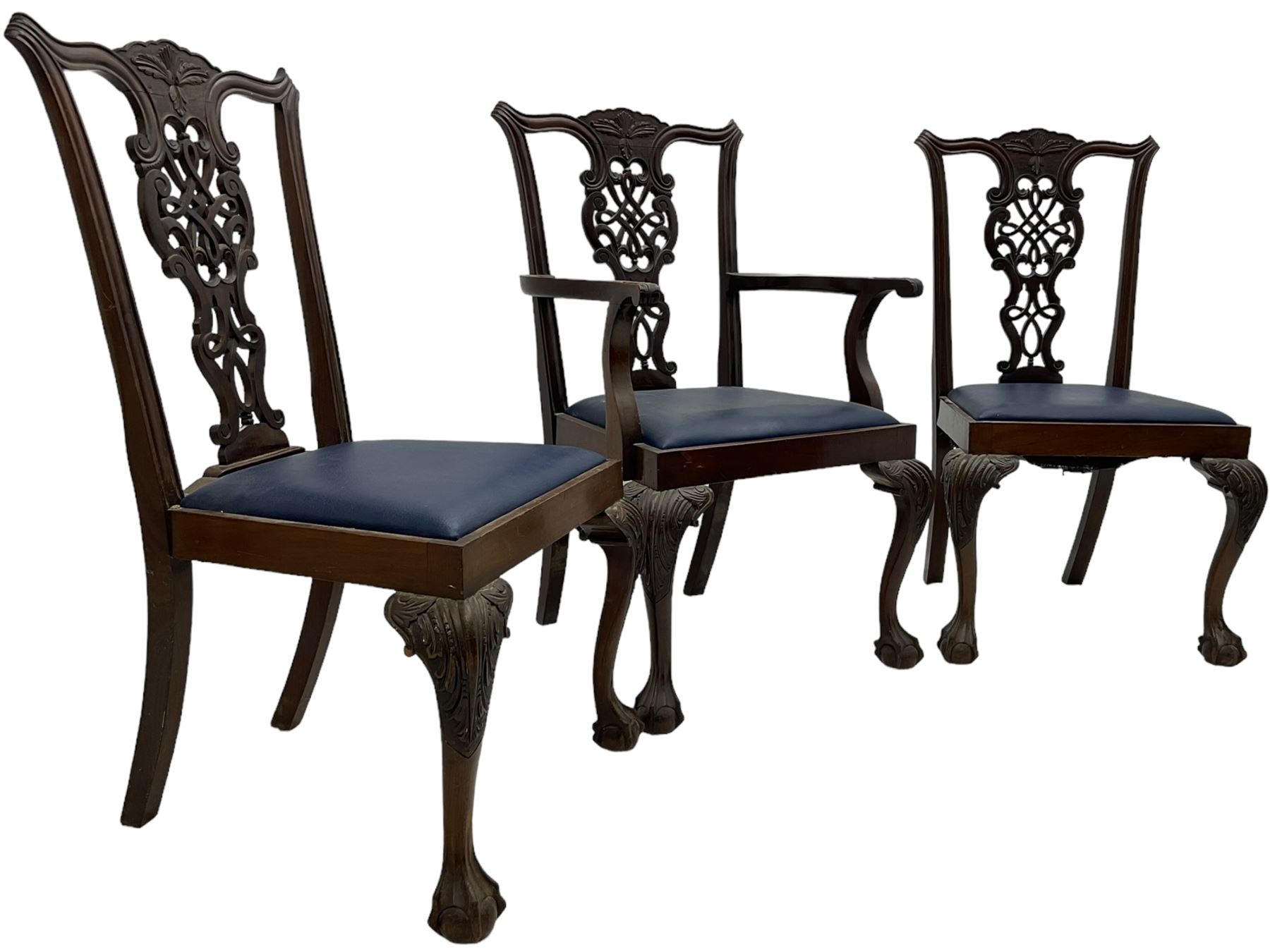 Set of six (5+1) Chippendale design mahogany dining chairs, shaped cresting rail over pierced splat with elaborately carved foliate and scrolling decoration, over drop-in upholstered seats, raised on cabriole supports with scrolled acanthus carved knees and ball and claw carved terminals