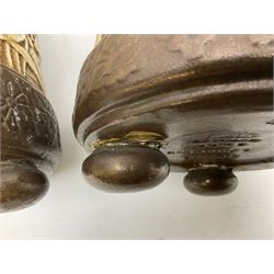 Pair of Bretby vases of tapering cylindrical form decorated with elephants, cranes and fishermen, the bodies with twin elephant mask handles, with coppered borders, raised upon three bun feet, stamped Bretby 2246 marks beneath, H32cm