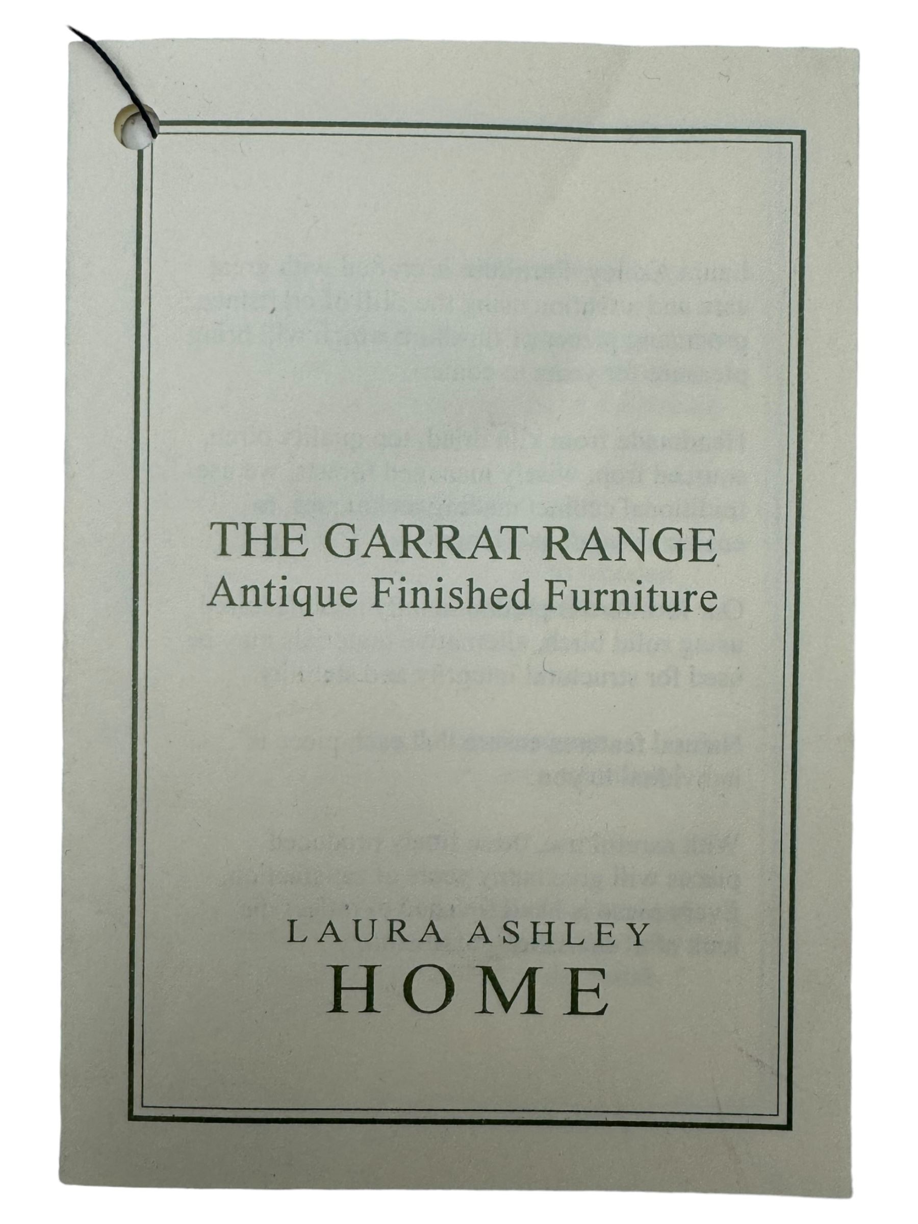 Laura Ashley - contemporary oak tall chest of drawers from the Garrat range, honeycomb rectangular top featuring central groove, over four small drawers with brass knob pulls and four long drawers with drop handles, on plinth base