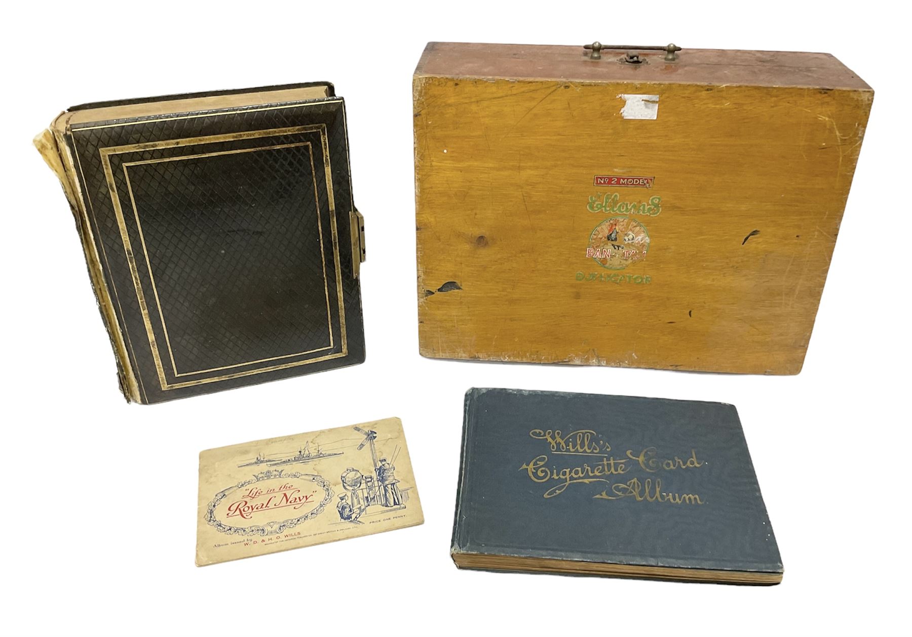 No 2 model Ellams Duplicator Ban Tam, together with a leather bound photo album and a 'Wills's cigarette card Album' full of cigarette cards