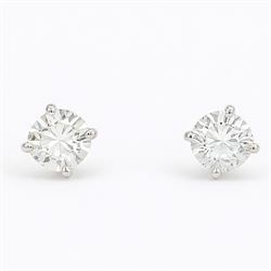 Pair of 18ct white gold diamond earrings, each stud set with a single round brilliant cut ...