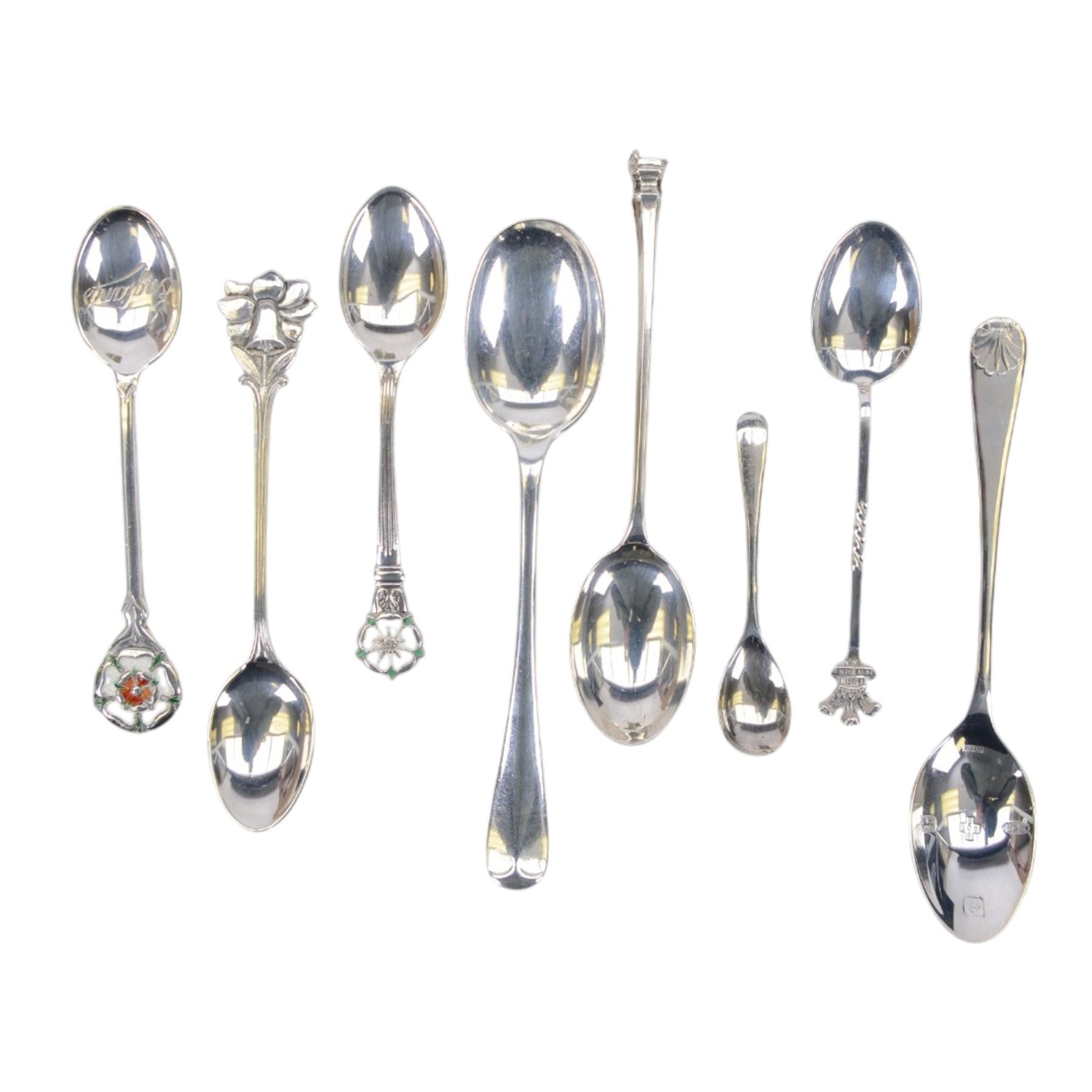 Group of silver, comprising two rectangular photograph frames, two pencil holders, boxed spoon and souvenir spoons, all hallmarked 