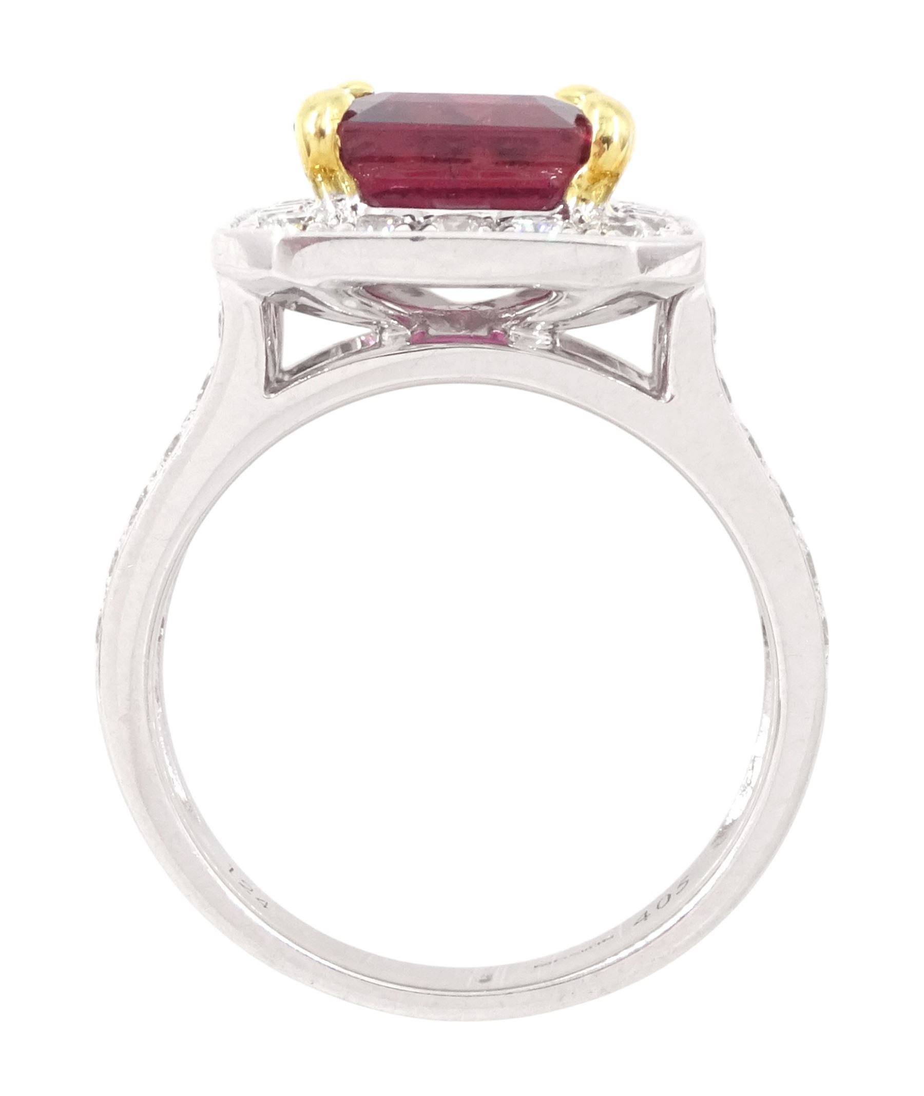 18ct white gold rubellite tourmaline and diamond cluster ring, single octagonal cut tourmaline of 4.05 carat, four claw set in yellow gold, surrounded by  round brilliant cut diamonds, with split diamond set shoulders, London 2013, total diamond weight 1.24 carat